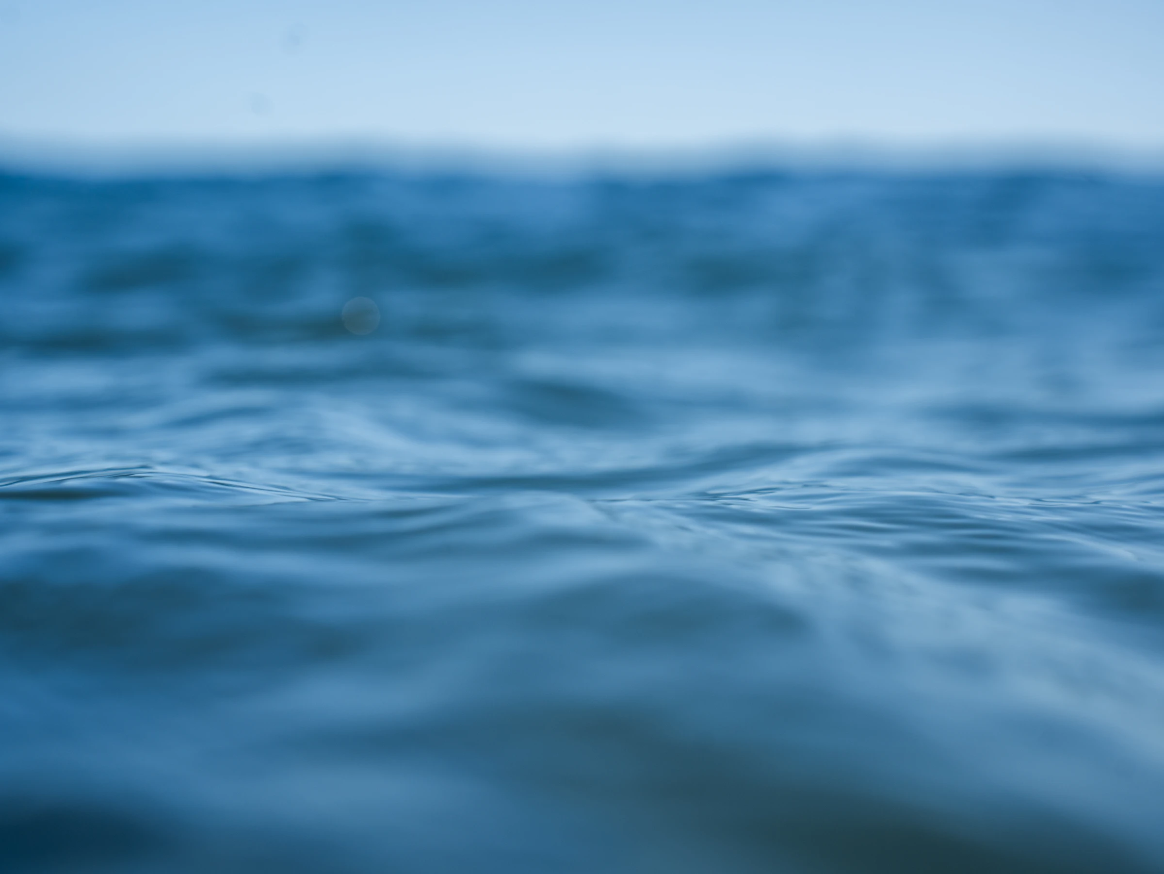 Calm blue water under a bright sky