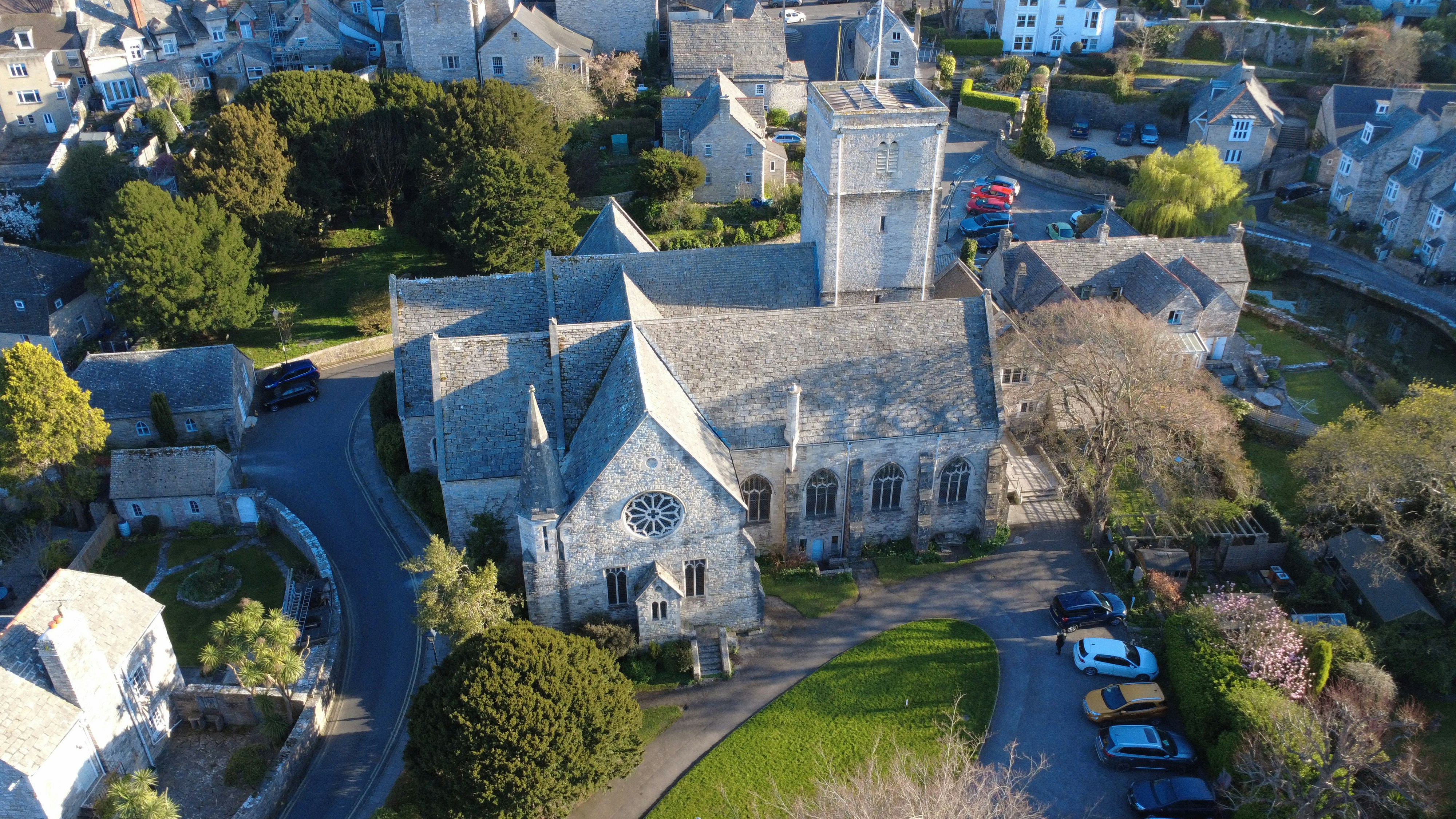 An aerial view of a church and town.