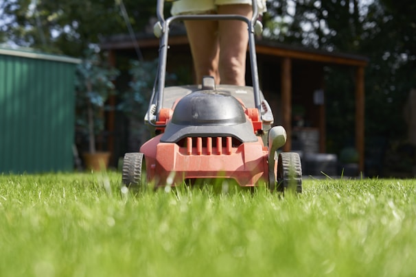 A person is mowing the lawn.