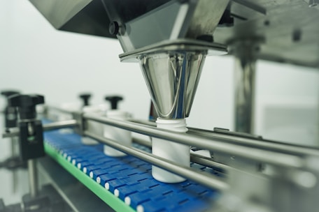 Bottles being filled on an automated production line.