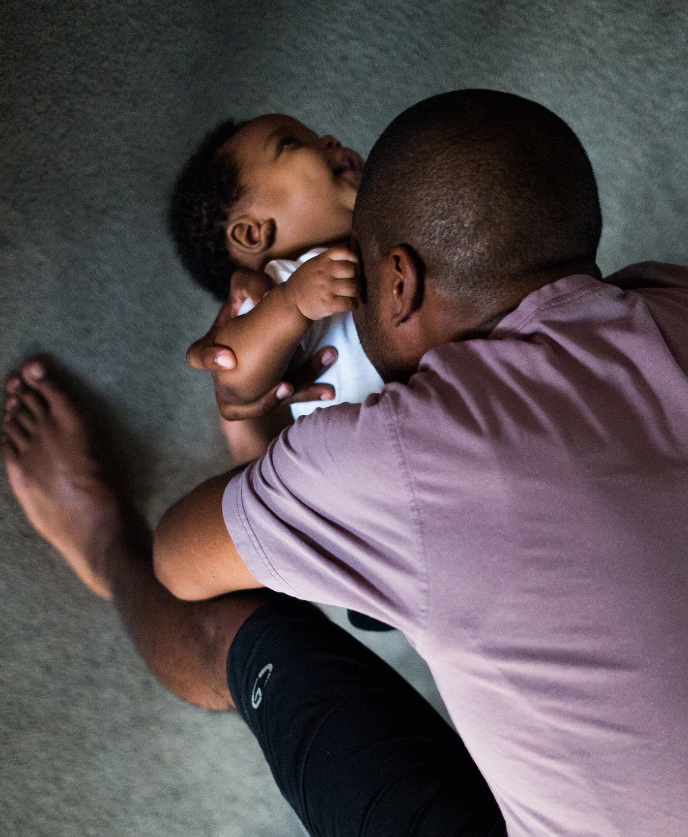 A father cradling his baby