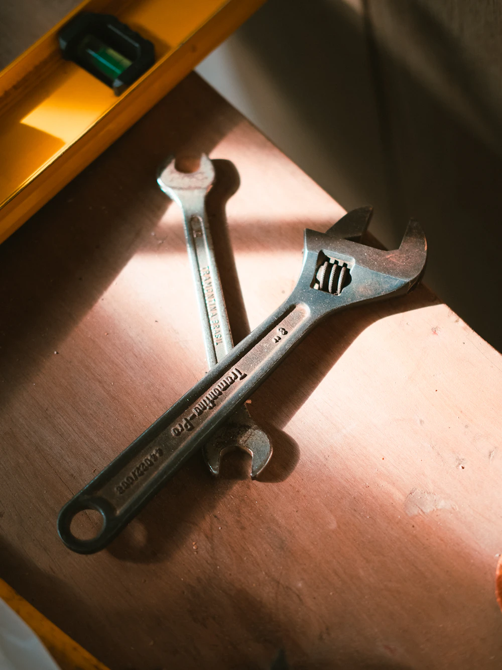 Wrenches and a level on the truck bench