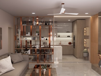 A modern living room with open kitchen and divider.