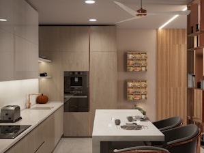A modern kitchen with a small breakfast bar.