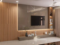 A modern living room with a mounted tv.