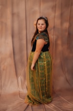 A woman dressed up as a disney princess.
