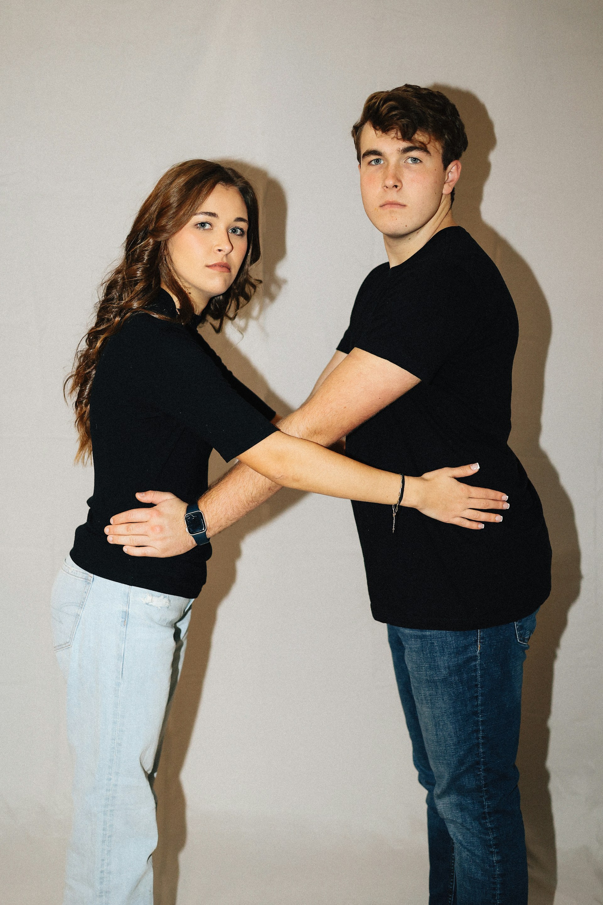 A woman and a man are posing together.