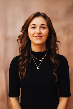 A smiling woman poses for a portrait.