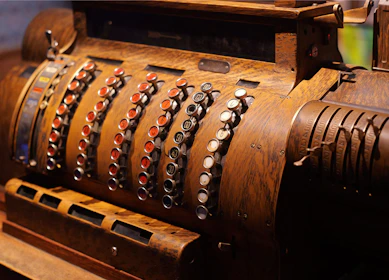 Antique cash register with detailed buttons.