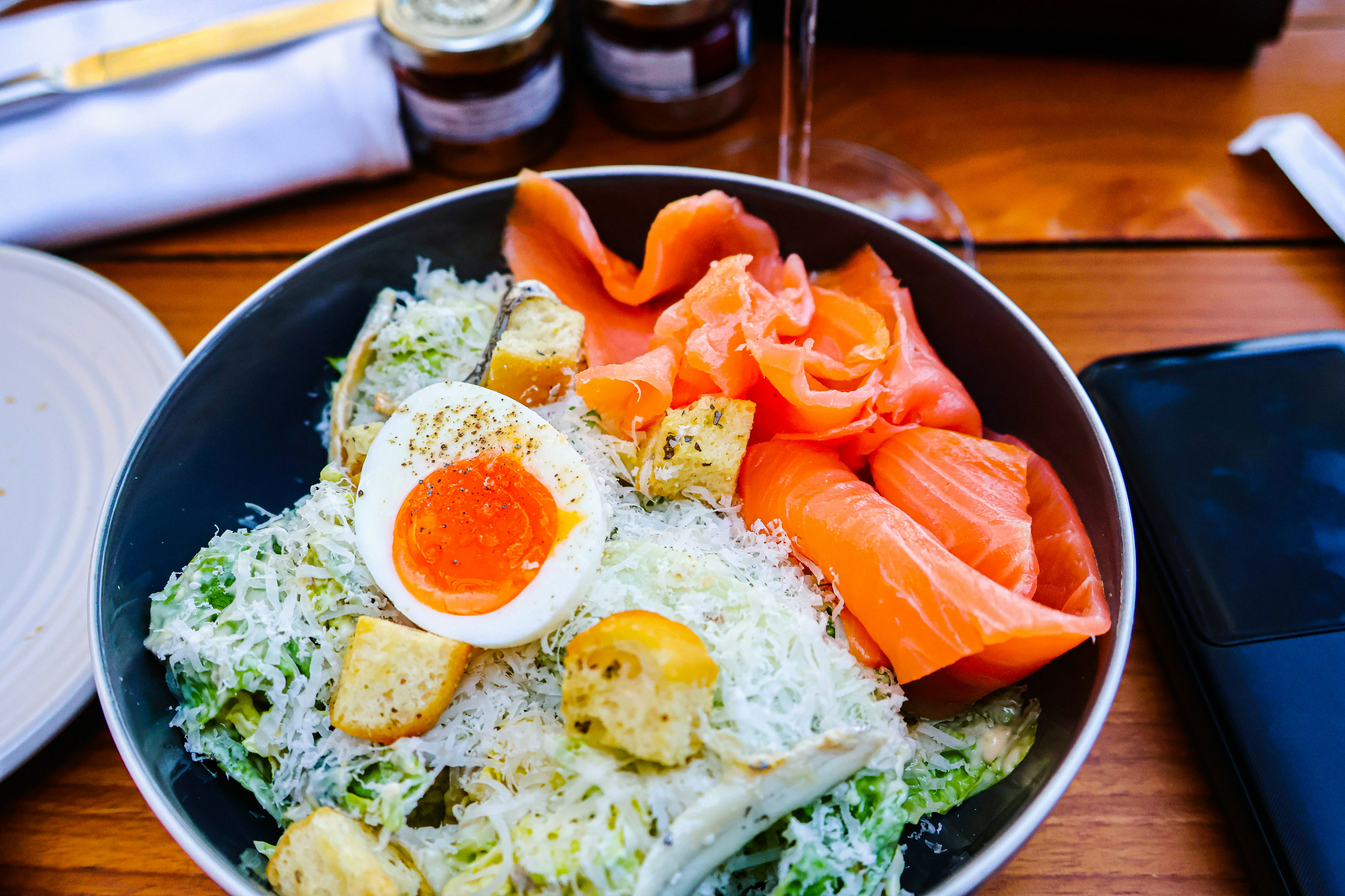 Salmon salad with egg and croutons.