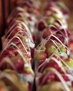 Apples are arranged in baskets.