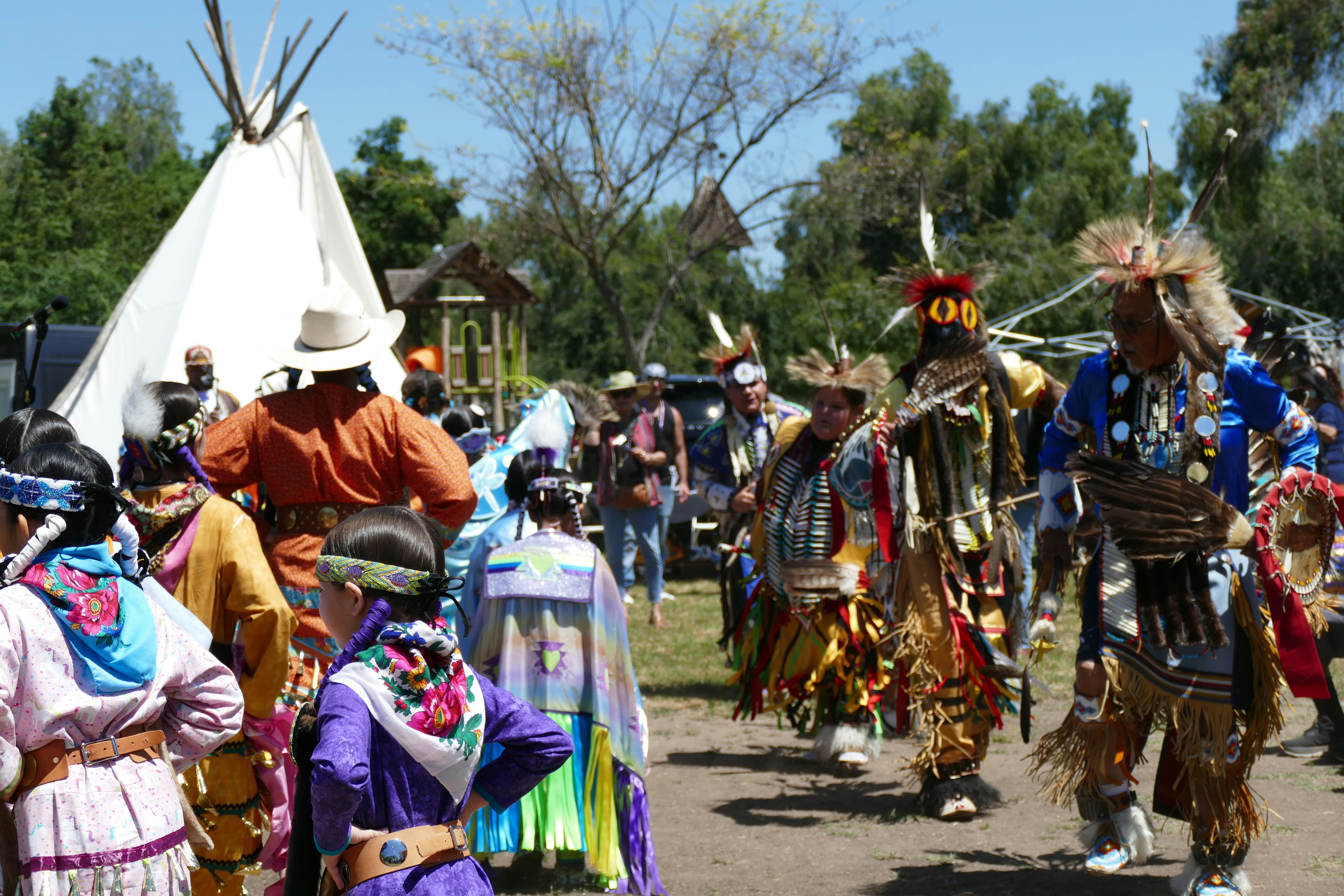 Indigenous people celebrate with a colorful gathering.
