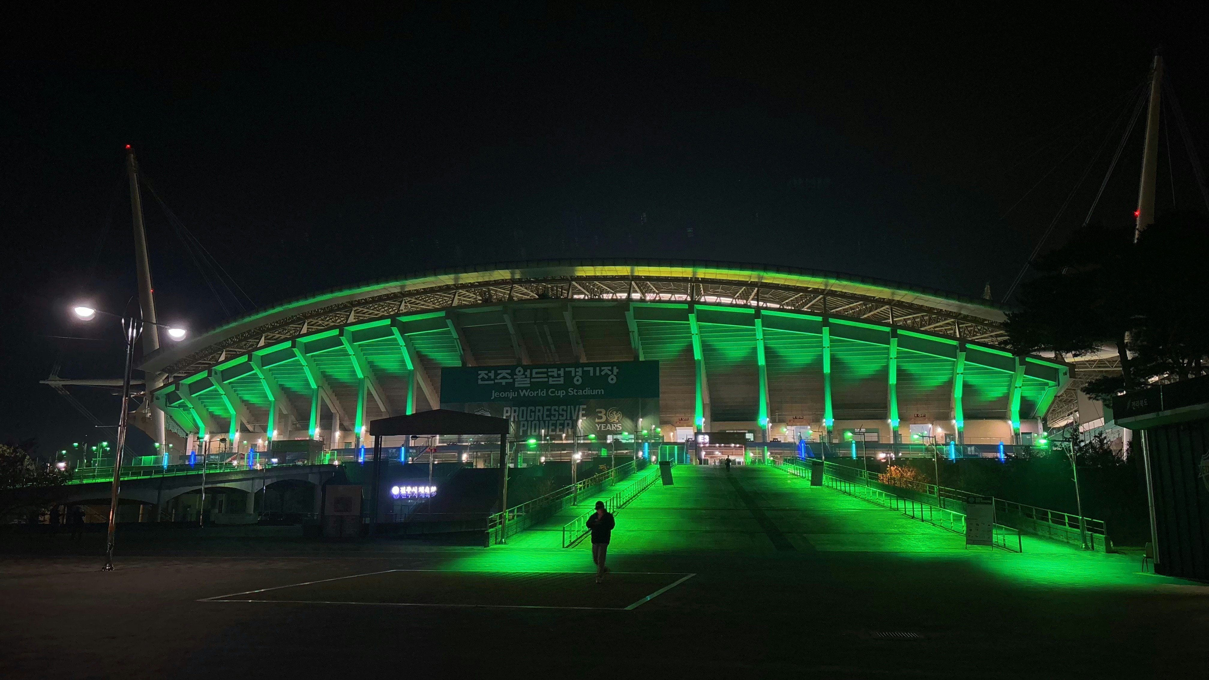 Stadium illuminated with green neon lights