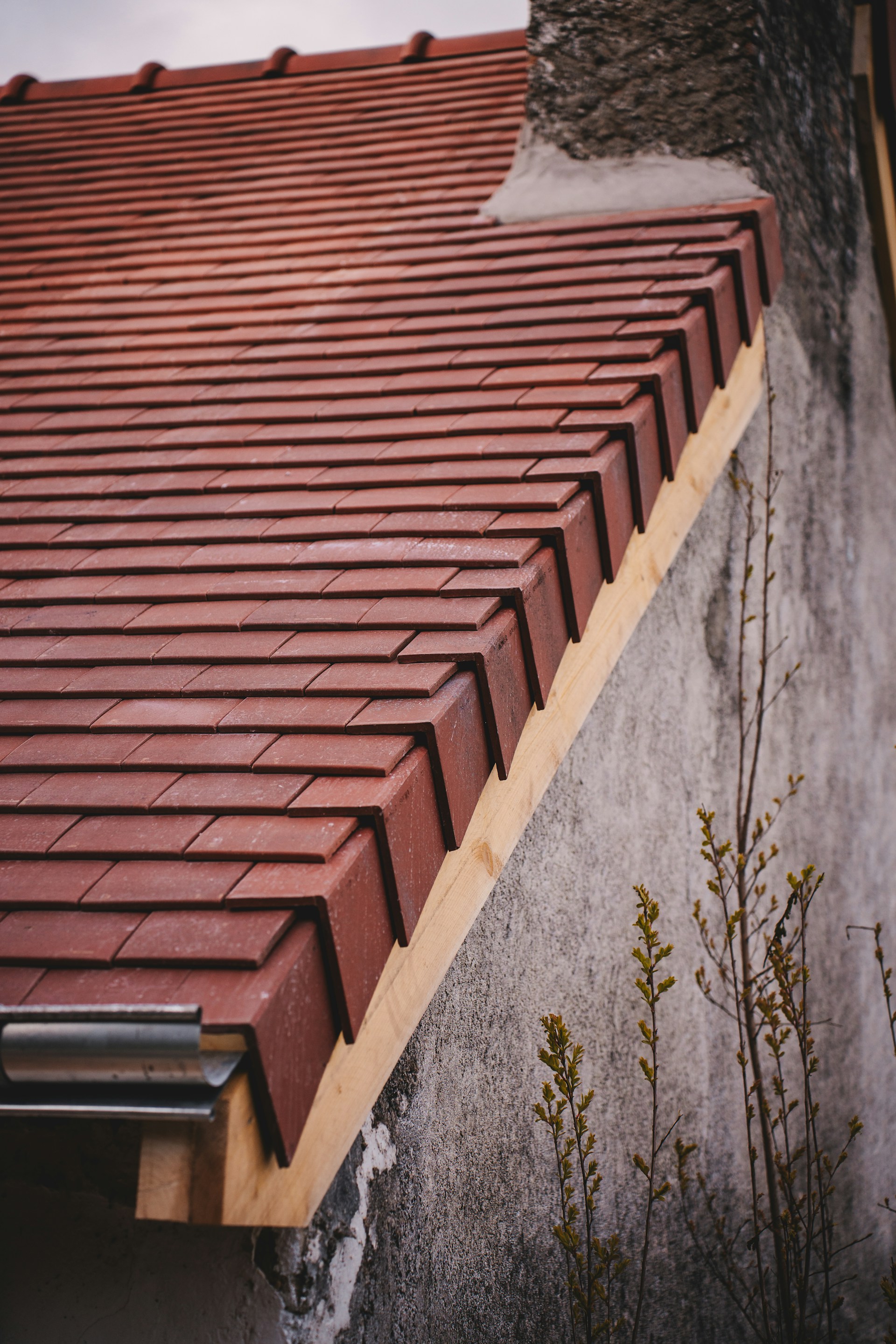 Newly tiled roof with a gutter system.