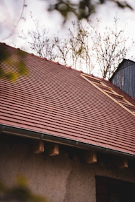 A red tiled roof with a ladder