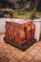 Tiles stacked on a pallet, ready for installation.