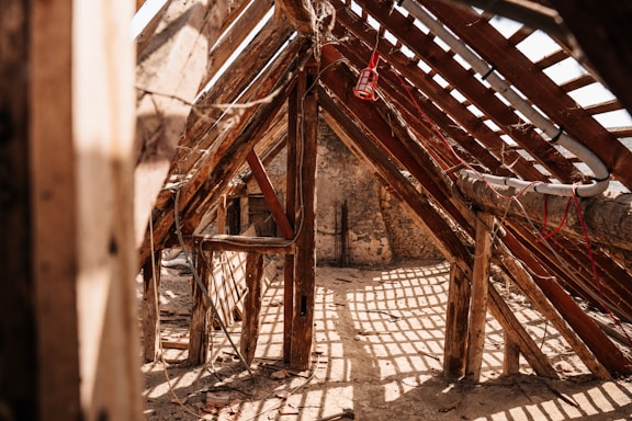Wooden rafters and beams in an old structure.