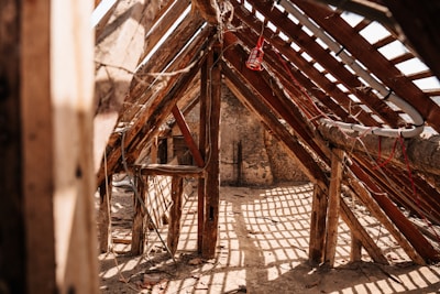 Wooden rafters and beams in an old structure.