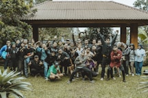 A large group of people smile for a photo.