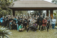 A large group of people smile for a photo.