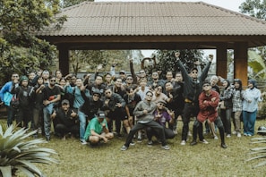 A large group of people smile for a photo.
