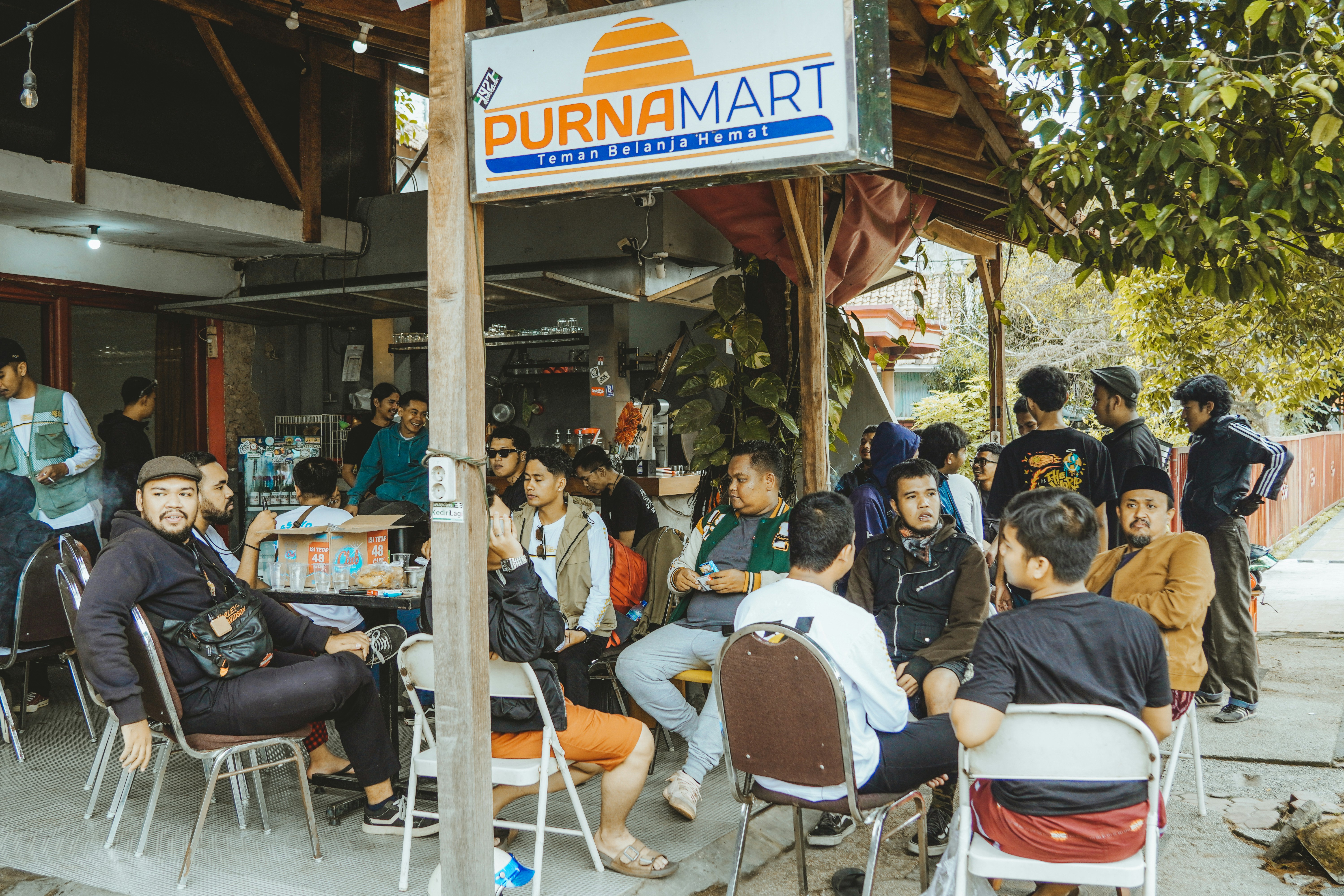 People gather outside of purnamart.