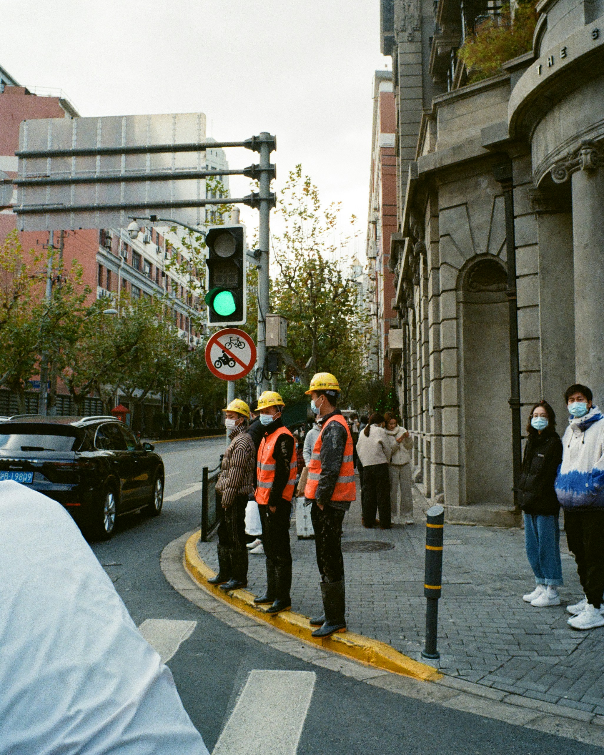 A safety officer demonstrating emergency procedures to a group of workers