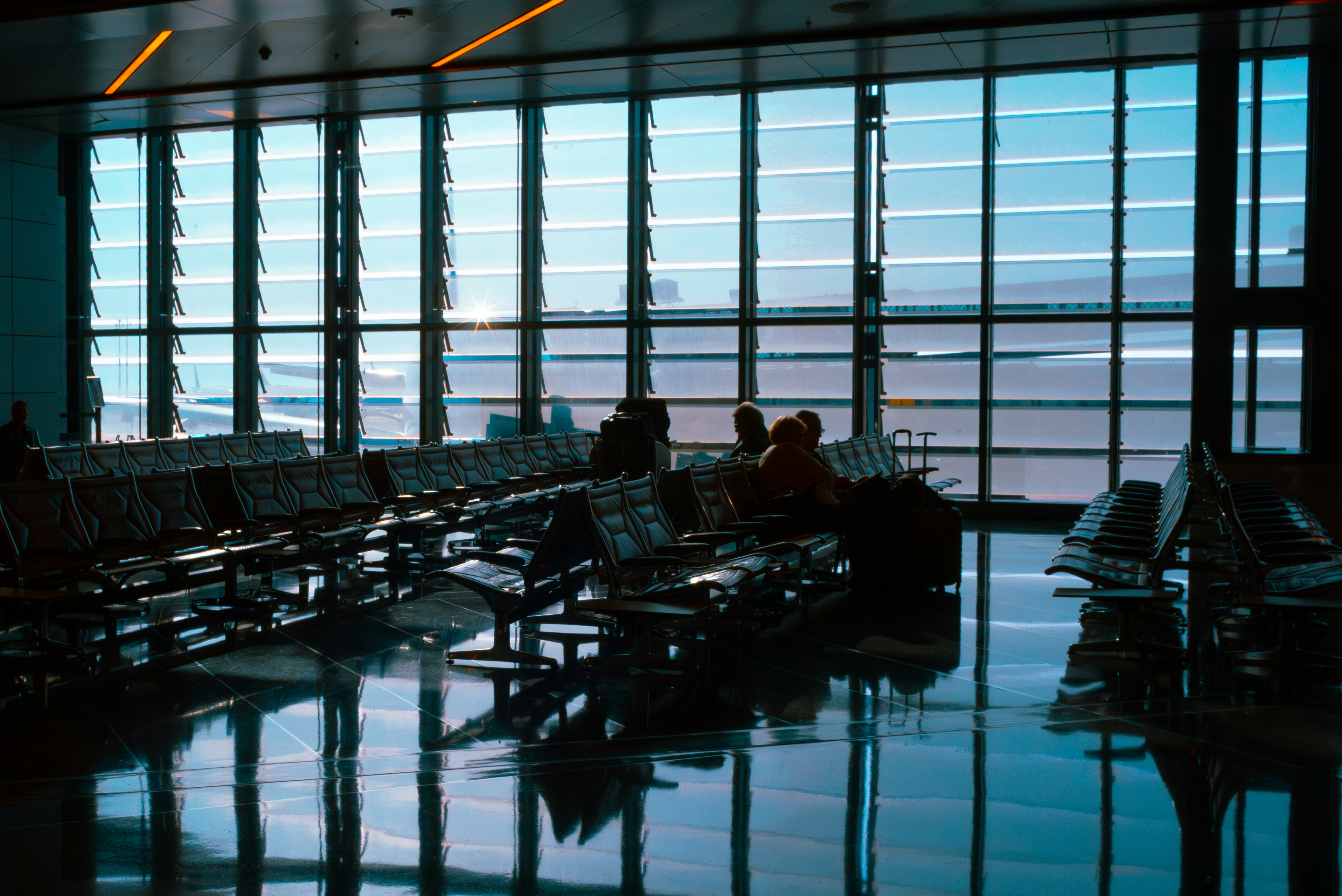 An airport terminal with waiting area., 