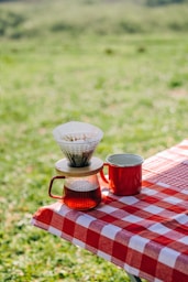 Coffee being brewed at an outdoor picnic.