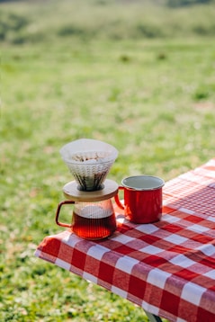 Coffee being brewed at an outdoor picnic.