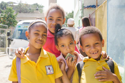 Happy children posing for a picture outdoors.