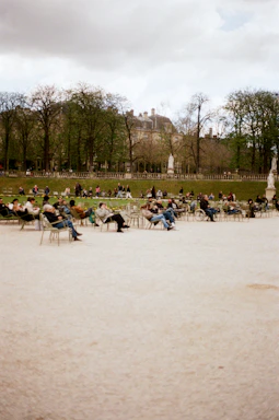 People relax in a park on a cloudy day.