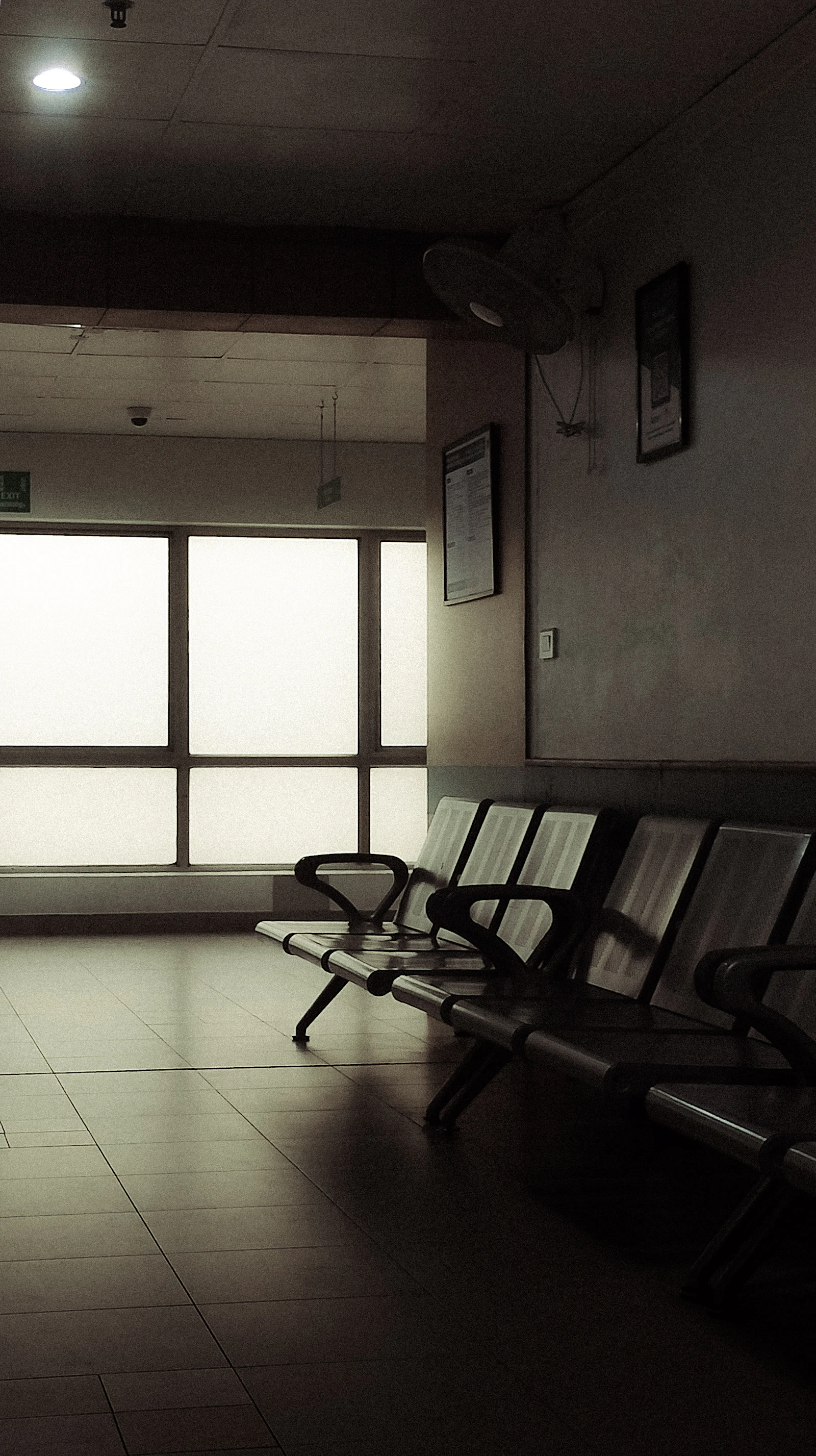 Calm waiting room with tidy rows of chairs.