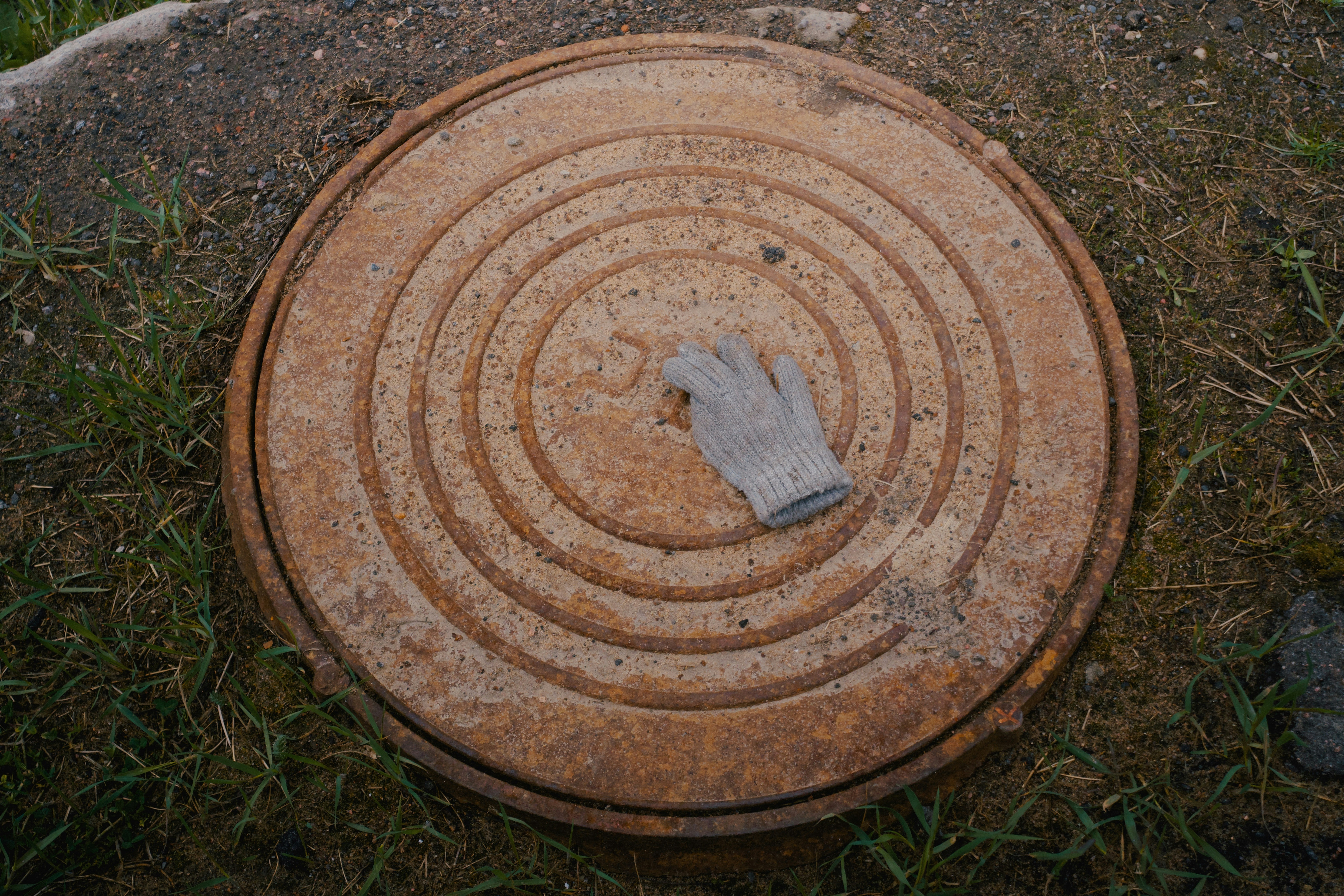 accessible septic tank riser and lid in residential yard