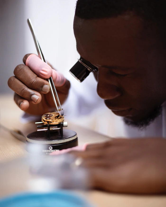 A watchmaker repairing a timepiece