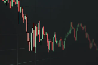 Stock market chart shows a declining trend.