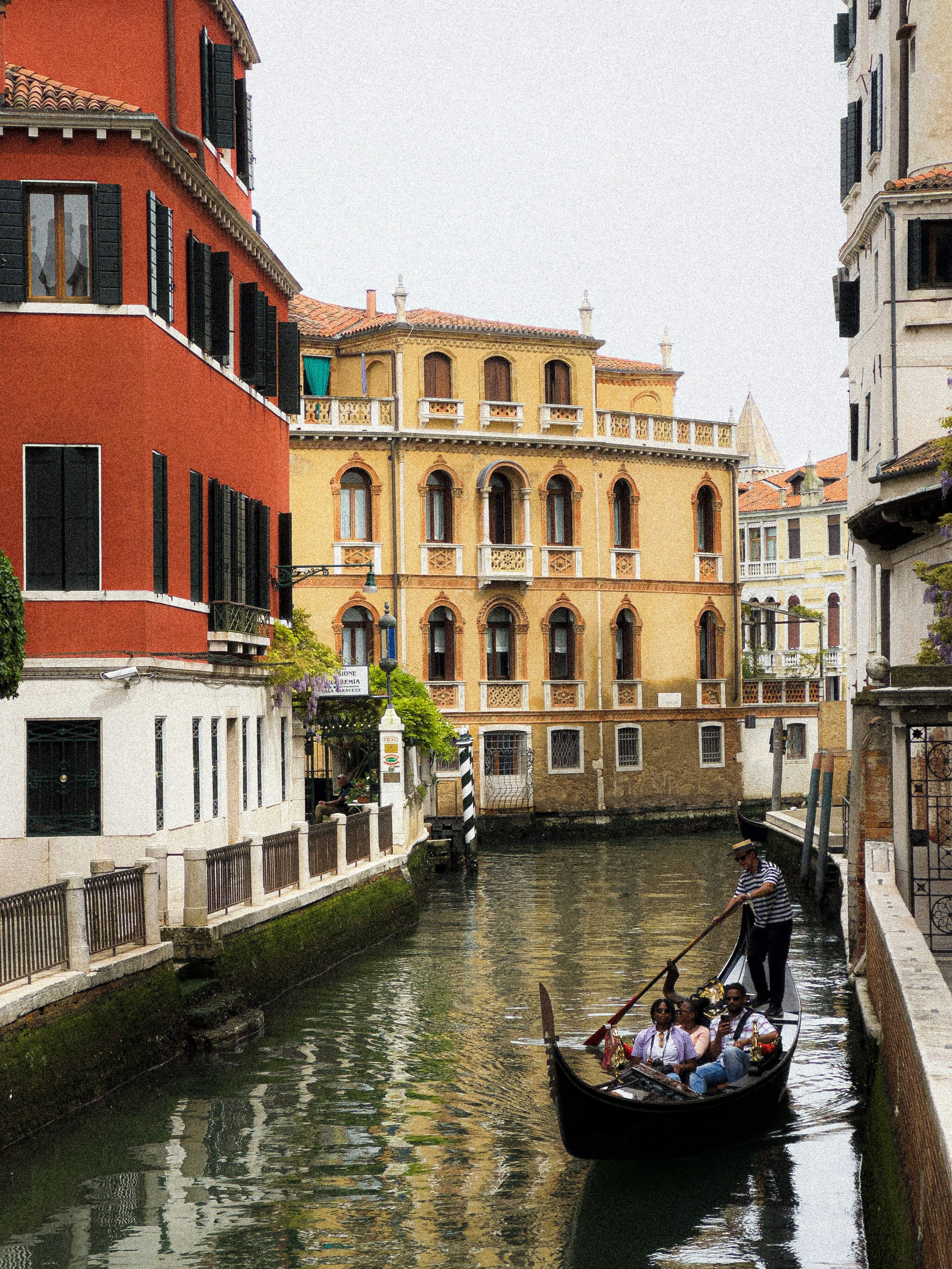 Gondola glides through the canals of venice.