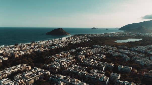 Aerial view of a city bordering the ocean.