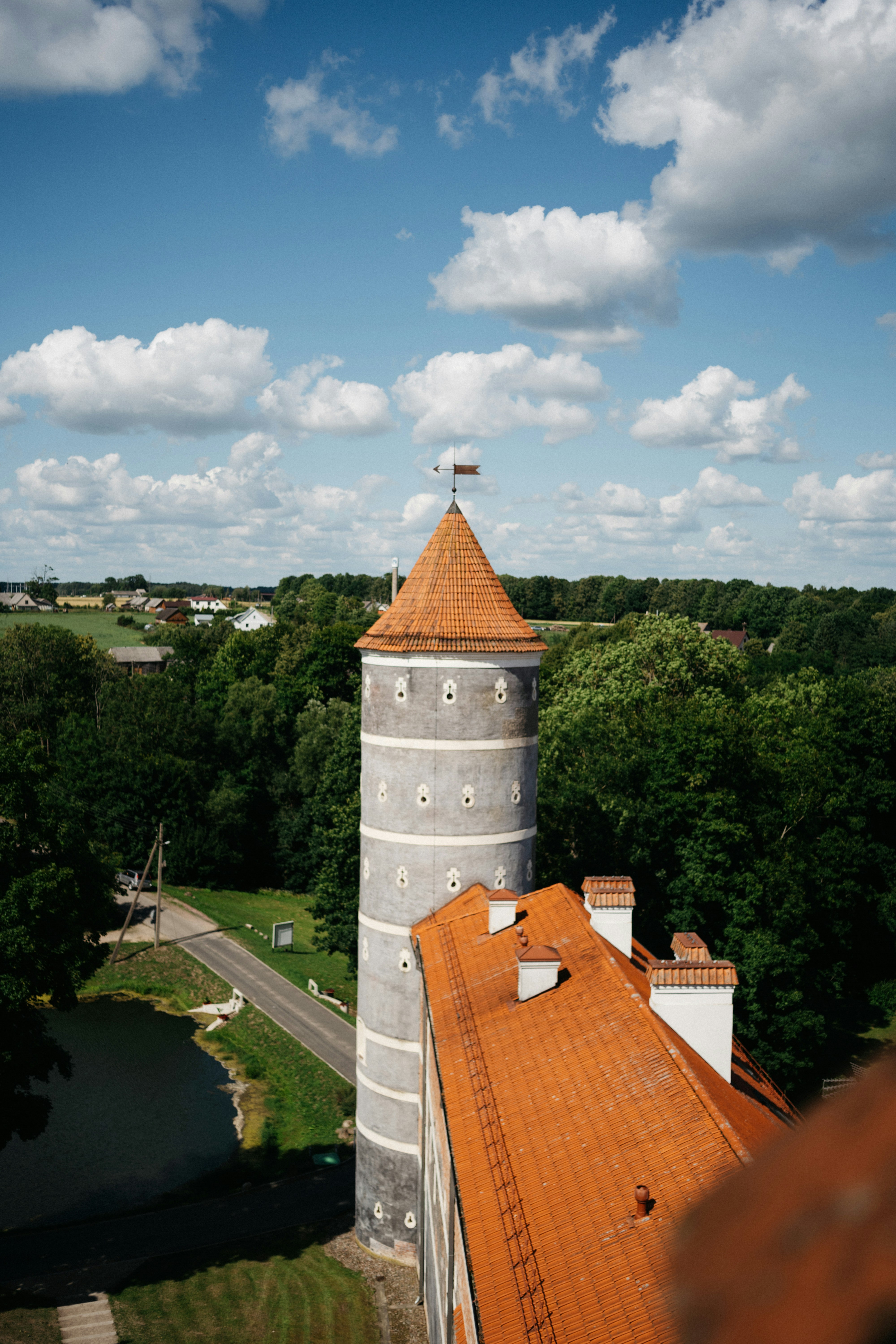 A tall tower stands against a blue sky.