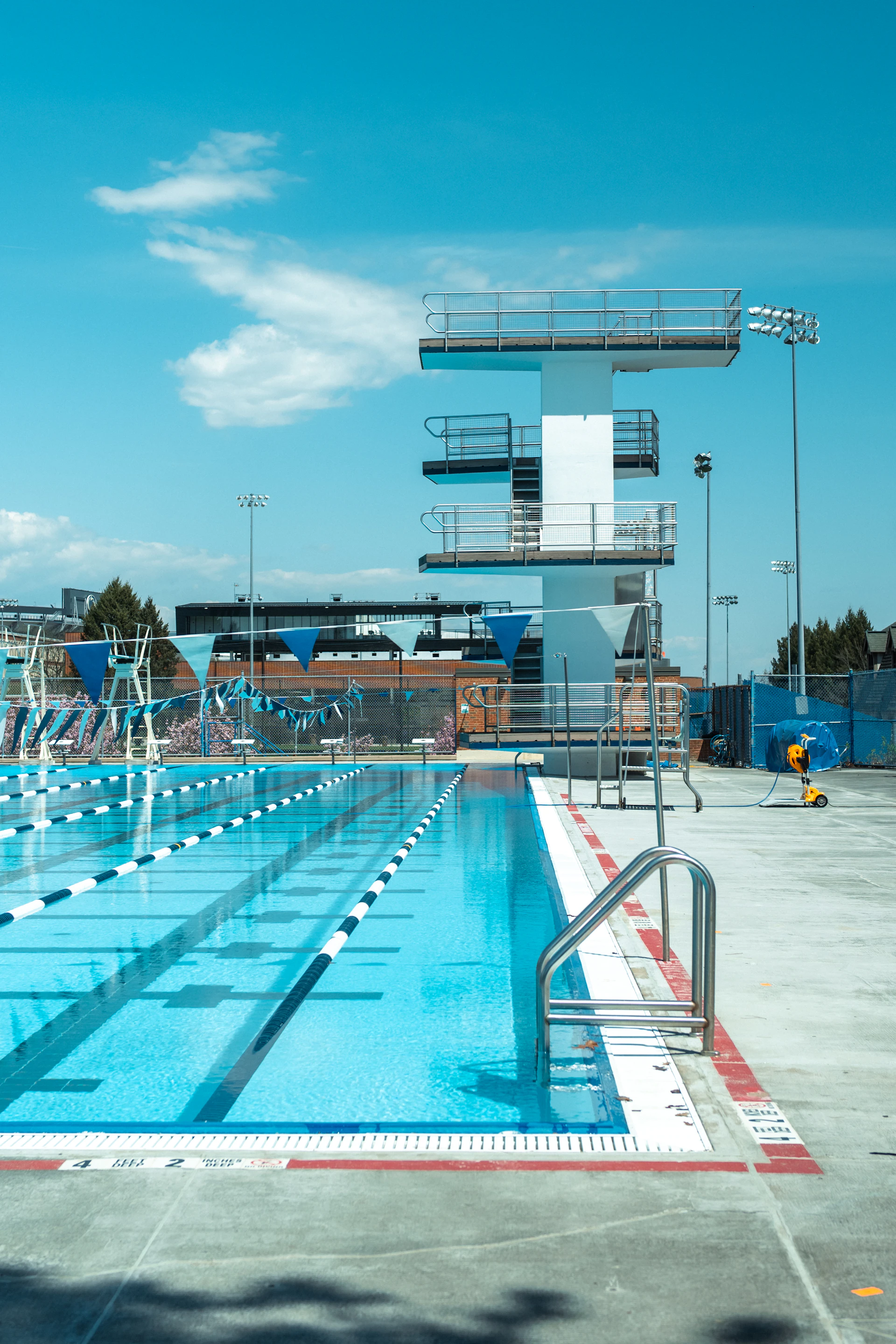 A swimming pool with a diving platform.