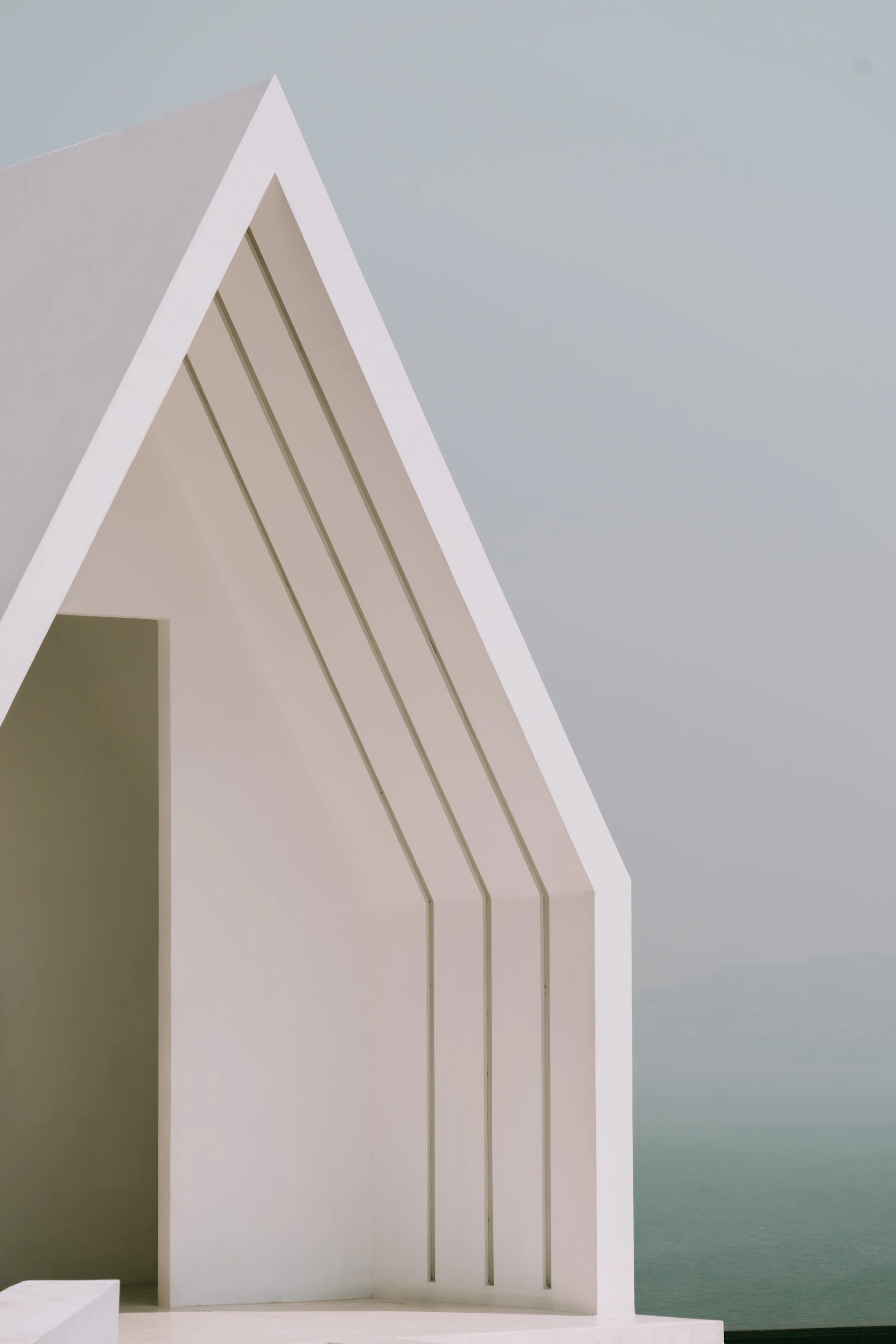 Minimalist white building with a unique architectural design