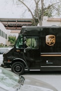 A ups truck is parked on a city street.
