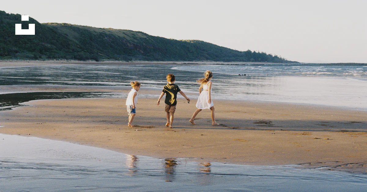 Kids Getting Sandy Three children are playing on a sandy beach. photo – Free Beach Image ...