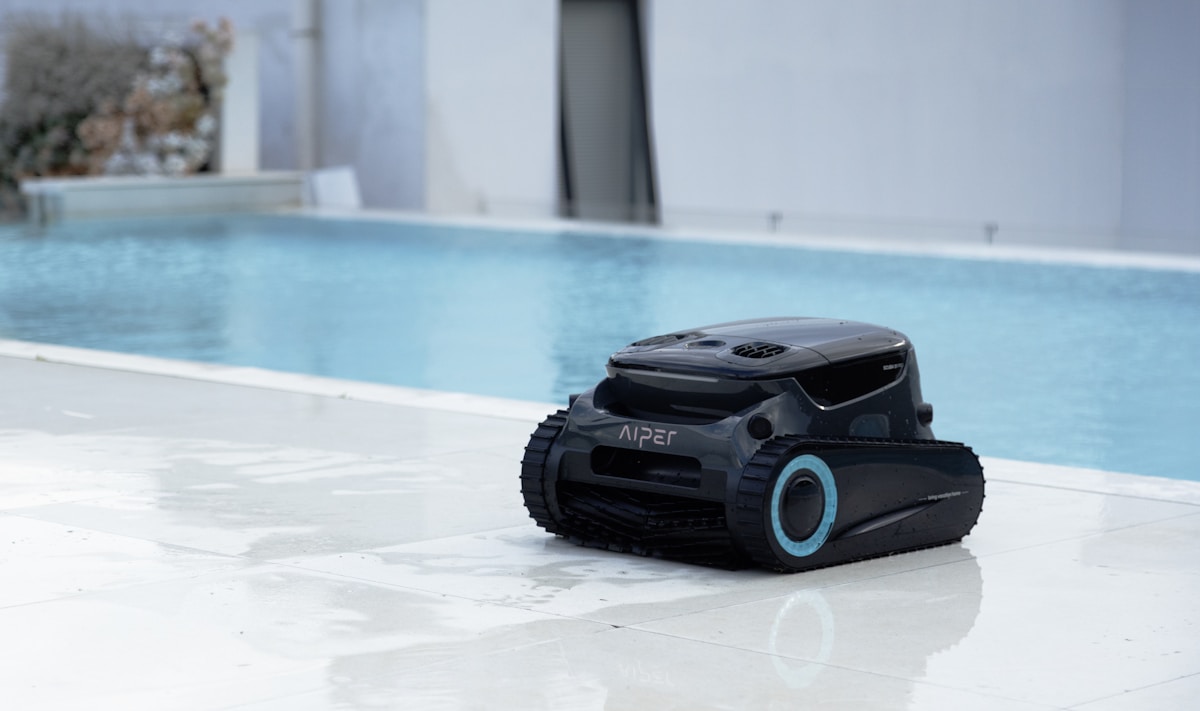 A pool robot cleans the pool's surface.