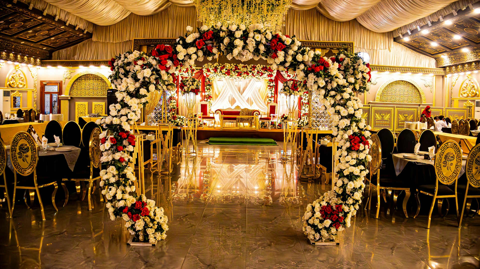Elegant venue decorated with flowers for an event.