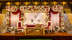 A beautiful wedding stage decorated with flowers