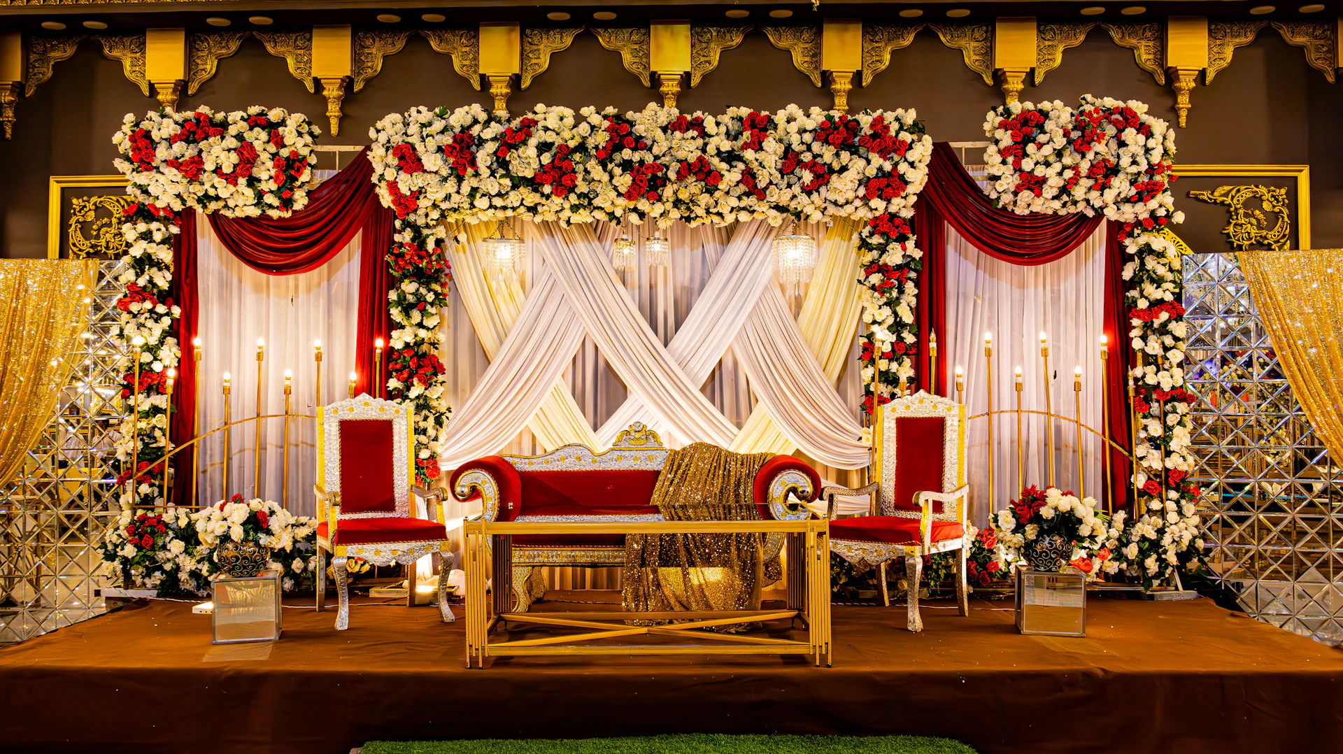 A beautiful wedding stage decorated with flowers