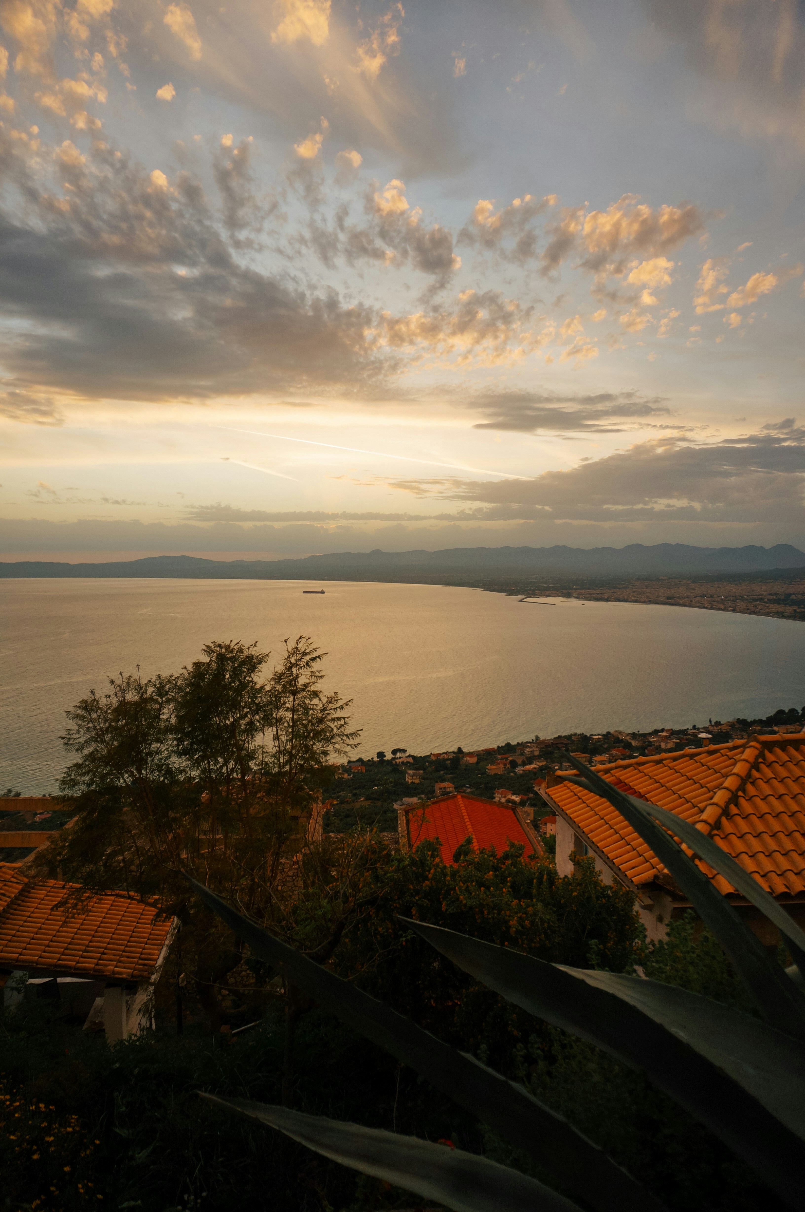 Sunset casts a glow over the water.