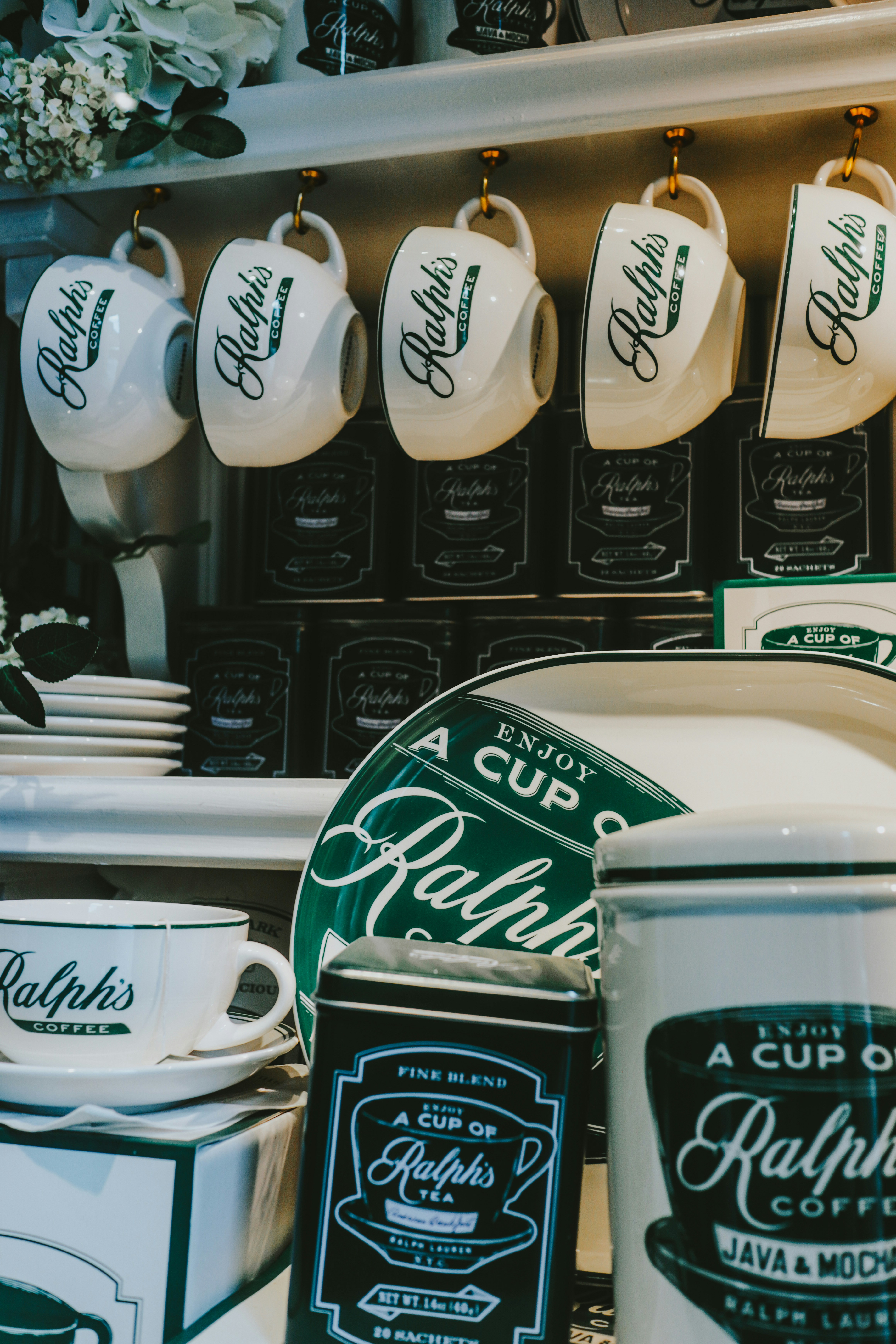 Ralph's coffee mugs, plates, and tins are on display.