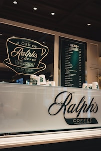 Ralph's coffee shop displays its menu and logo.